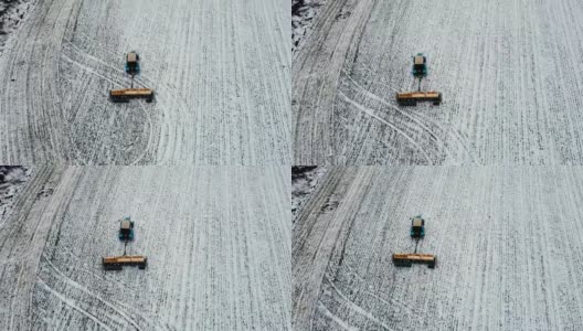 冬季利用拖拉机在有积雪的农业区施肥，为春季作准备高清在线视频素材下载