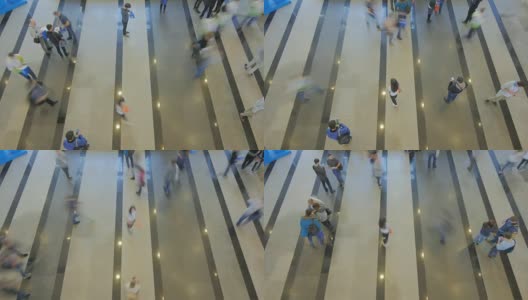 时间流逝俯视图，人们行走在商业中心的室内论坛高清在线视频素材下载