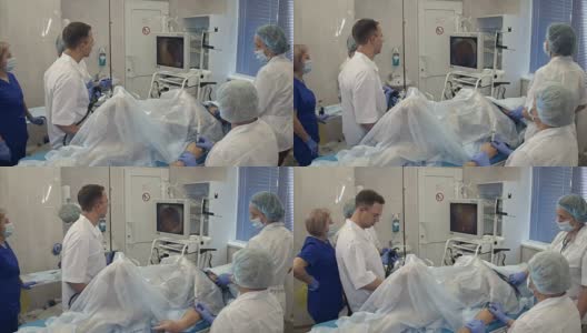使用内窥镜进行手术的医疗队高清在线视频素材下载