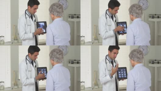 墨西哥医生向一位老年妇女解释脑部扫描高清在线视频素材下载