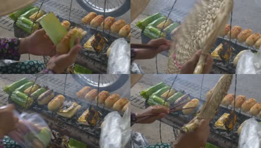 越南的街头小吃，香蕉烤米卷。特写女人的身体部分准备在街上的早餐。高清在线视频素材下载
