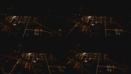 飞过夜晚的城市。俯视图的现代大都市高清在线视频素材下载