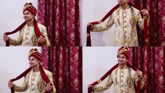 年轻的印度新郎在婚礼上为摄影师摆姿势高清在线视频素材下载