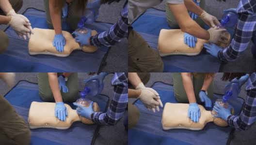 医学教育与实践。医疗人体模型娃娃紧急援助。医生在假人上进行人工呼吸训练。高清在线视频素材下载