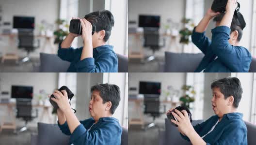 一位年长的亚洲老妇坐在家里的客厅里玩完虚拟现实眼镜，一放就感到兴奋和满足。退休者学习新技术体验的概念。高清在线视频素材下载
