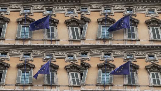 欧洲共同体的旗帜在一座古老的建筑上飘扬。高清在线视频素材下载