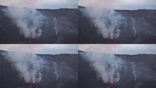 观察尼拉贡戈活火山的火山口，熔岩湖喷出浓烟高清在线视频素材下载