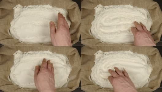 俯视图:人的手触摸一个囊中的小麦粉高清在线视频素材下载