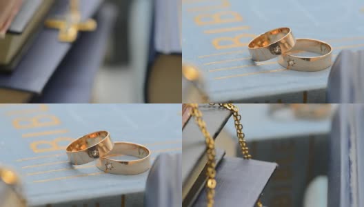 两个结婚戒指与十字架在书柜，放大，与滑块拍摄高清在线视频素材下载