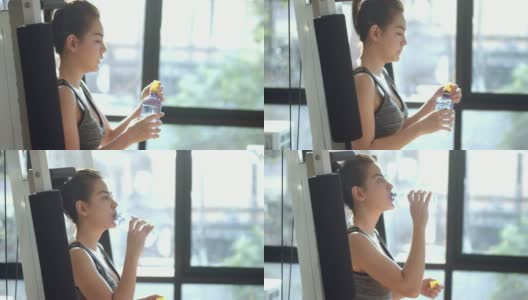 亚洲女人在健身房喝能量饮料高清在线视频素材下载
