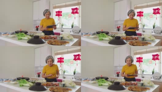 中国老妇人在厨房准备新年食物高清在线视频素材下载