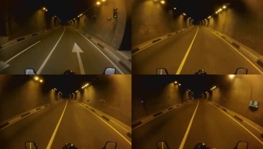 摩托车自驾游，走向冒险，穿越黑暗幽暗的隧道，视角，视角，个人视角，旅行理念高清在线视频素材下载