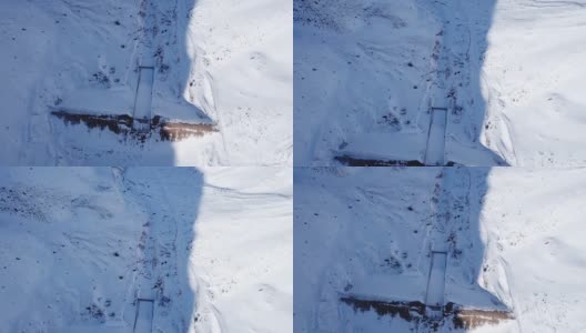 山上的水坝被雪覆盖着高清在线视频素材下载