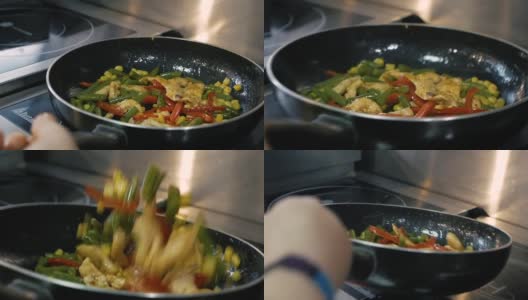 厨师用热锅烹饪鸡肉和蔬菜高清在线视频素材下载