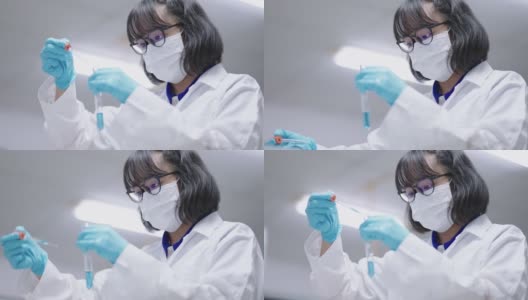 年轻的亚洲女科学家在实验室进行研究高清在线视频素材下载