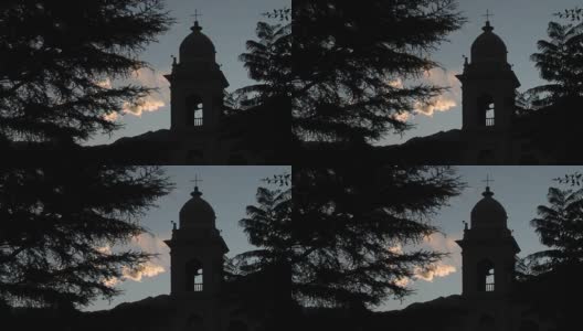 阿根廷萨尔塔省日落时分，卡法亚特圣母教堂的钟楼剪影。高清在线视频素材下载