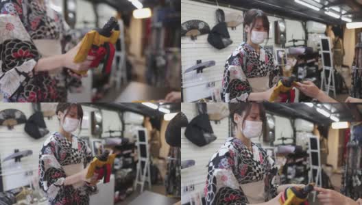 穿着浴衣的日本妇女在日本传统零售商店购物高清在线视频素材下载