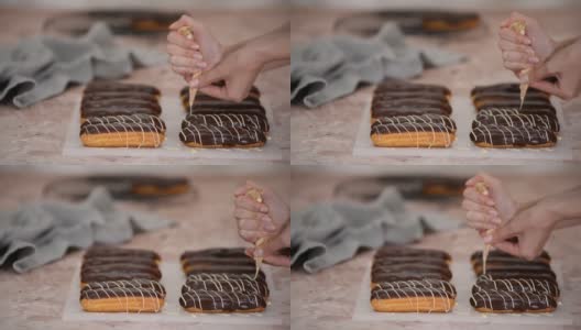 糕点师将白巧克力倒在法式泡芙上。高清在线视频素材下载