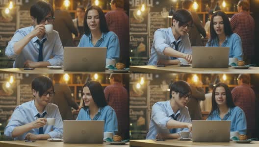 英俊的亚洲男人和美丽的高加索年轻女人坐在咖啡馆在笔记本电脑上工作。在后台其他客户在时尚的环境。高清在线视频素材下载