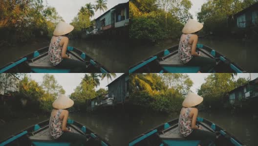 一名妇女乘船穿过湄公河三角洲高清在线视频素材下载