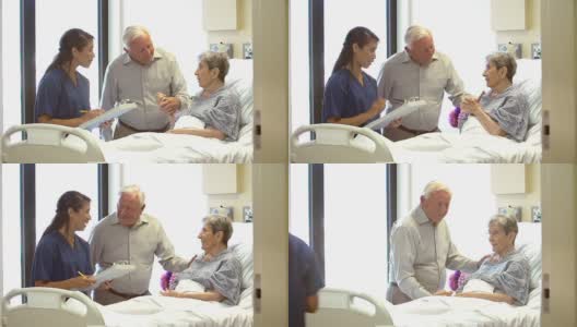 护士在病房里和一对老年夫妇谈话高清在线视频素材下载