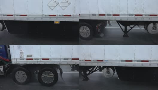 慢镜头:一辆半挂车行驶在道路上，雨点从底盘上喷射出来高清在线视频素材下载