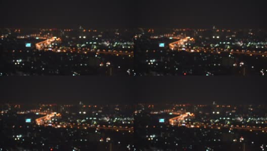 4k视频场景从交通车辆模糊散焦灯光和城市生活在曼谷夜间散焦，城市景观和抽象概念高清在线视频素材下载