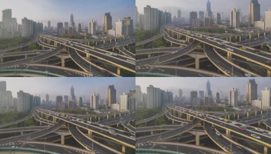 空中运动日时间高架公路交汇处x形道路日落时的鸟瞰图时间间隔。交通运输概念在城市城市，上海市中心，中国在4k视频高清在线视频素材下载