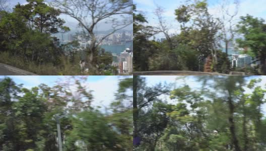 躲在灌木丛中行驶的巴士可以看到香港的风景高清在线视频素材下载