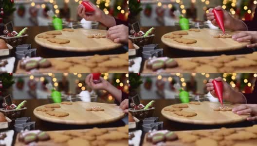 自制的圣诞饼干和新年快乐。在家里和朋友和家人一起做姜饼。高清在线视频素材下载