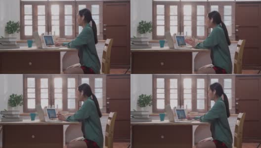 亚洲自由职业年轻女商人电话会议与同事在家里工作高清在线视频素材下载