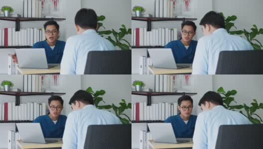 慢镜头亚洲男医生在办公室为病人讲解病历和体检结果，就医疗保健概念向病人建议和咨询高清在线视频素材下载
