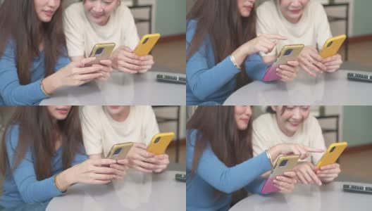 亚洲女性朋友一起在客厅用智能手机玩游戏高清在线视频素材下载