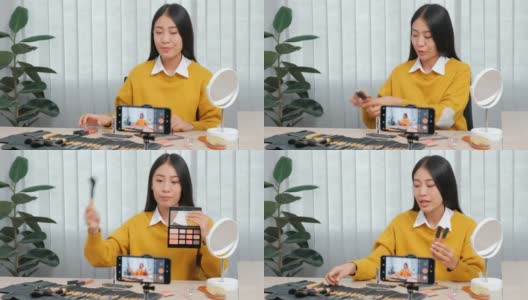 亚洲美女网红录制视频在线直播与化妆品网红在社交媒体概念直播病毒式视频。高清在线视频素材下载