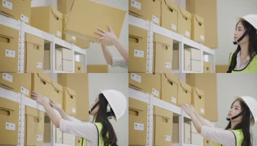 亚洲女工在仓库分拣箱子到仓库货架，储存和分配的概念。高清在线视频素材下载