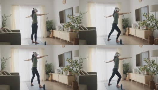一名年轻女子戴着VR头盔在家锻炼高清在线视频素材下载