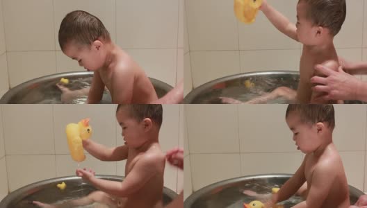 宝宝在洗澡的时候玩碎石鸭高清在线视频素材下载