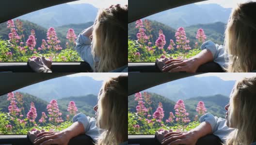 女人的特写向窗外看，在静止的车里高清在线视频素材下载