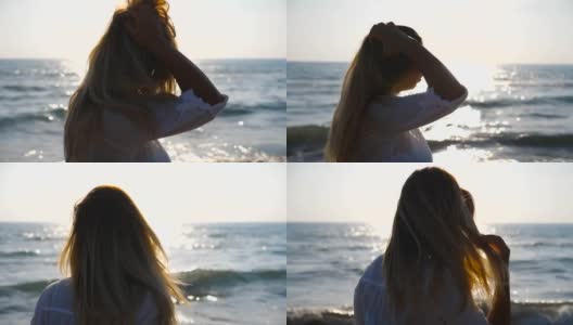 年轻女孩沿着海岸散步，玩弄着她的金发。美丽的女人在暑假旅行中享受生活。背景是平静的海浪。关闭侧视图慢动作高清在线视频素材下载