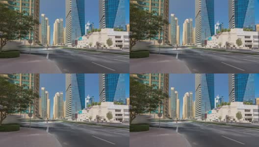 迪拜码头与摩天大楼的时间推移坍塌和交通在街道附近的混凝土公路桥通过运河高清在线视频素材下载