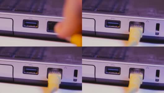 特写的以太网电缆插头插入端口在一边的笔记本电脑高清在线视频素材下载