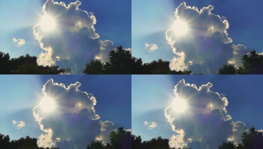 明亮的阳光光线显示后面的大白云在蓝天的背景高清在线视频素材下载
