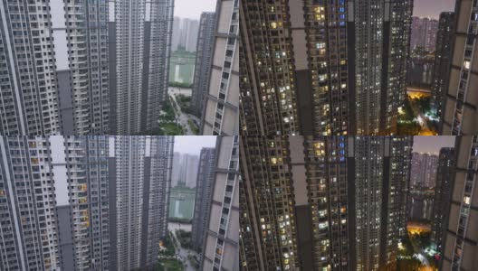 中国武汉几幢高层住宅现代城市建筑窗户中光线的时间流逝和街景高清在线视频素材下载