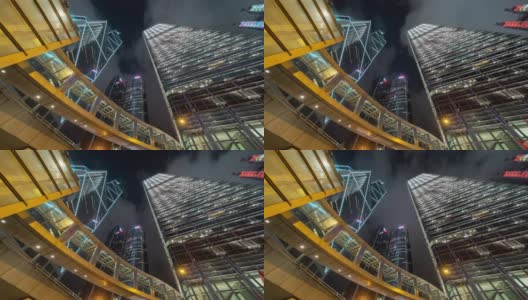 时间流逝的高层写字楼，摩天大楼，建筑在金融区。智慧城市为商业和科技的概念背景，在香港市中心的夜晚高清在线视频素材下载