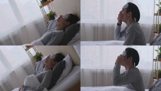 一个戴着眼罩睡在床上的男人高清在线视频素材下载