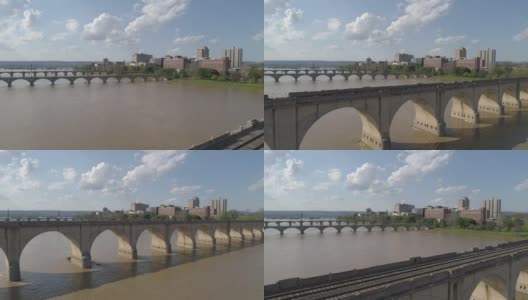 历史悠久的胡桃街铁路桥，市场街桥，以及其他横跨萨斯奎哈纳河的桥梁，在宾夕法尼亚州哈里斯堡市中心的远处可以看到。无人机拍摄的航拍视频。高清在线视频素材下载
