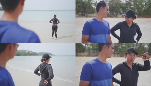 亚洲夫妇在夏日阳光明媚的沙滩上慢跑高清在线视频素材下载