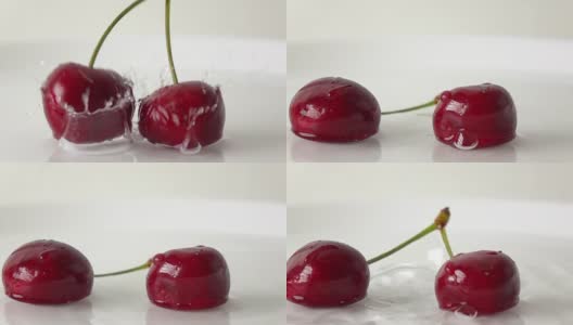 用超级慢镜头拍摄两颗樱桃用同样的茎打湿的白色盘子高清在线视频素材下载
