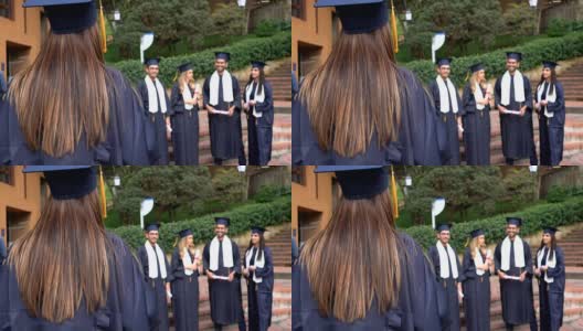一群庆祝博士毕业的朋友拥抱着高清在线视频素材下载