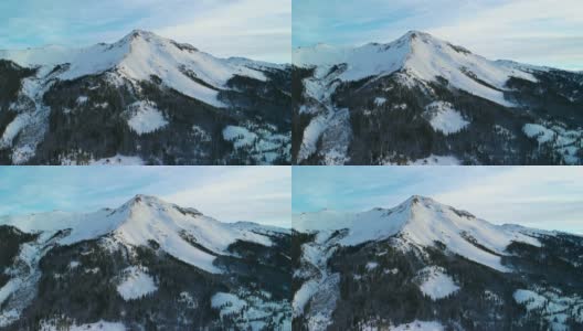 无人机拍摄的雪峰圣胡安山脉(落基山脉)外的奥雷，科罗拉多州在冬天的早晨被树林包围高清在线视频素材下载
